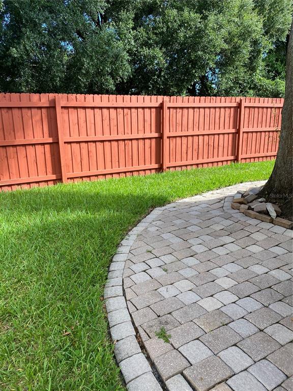 656 Boniview Lane Altamonte Springs, FL 32714 - Photo 15 of 17 a view of a backyard with a small garden