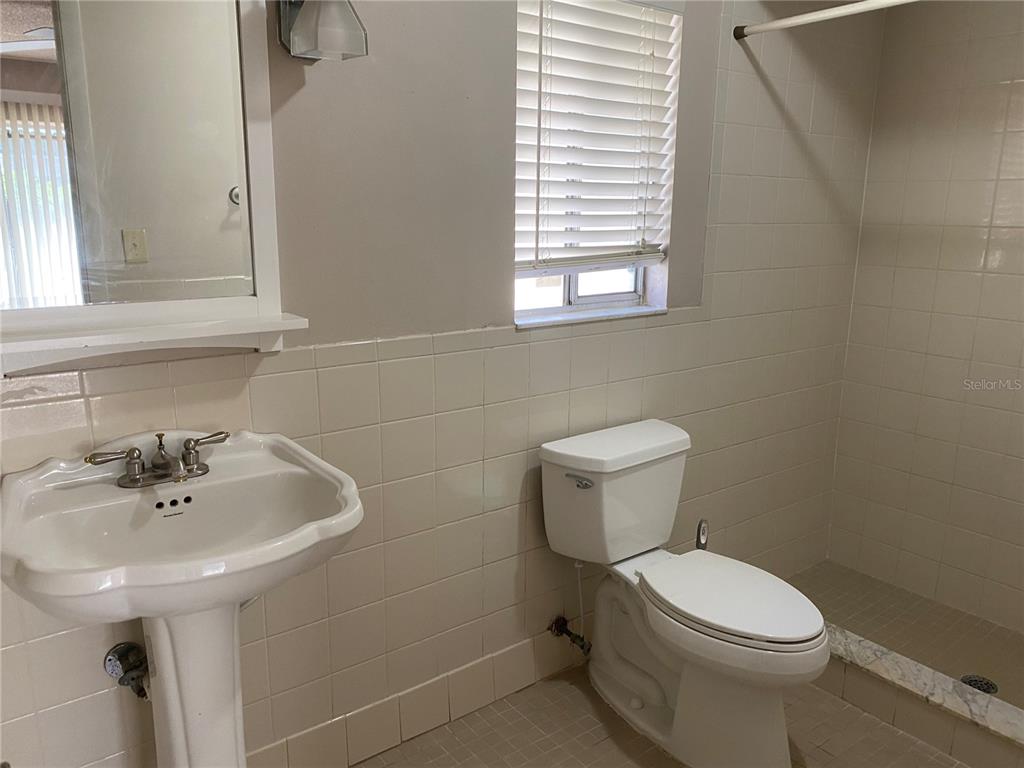 656 Boniview Lane Altamonte Springs, FL 32714 - Photo 10 of 17 a bathroom with a sink a toilet and a mirror