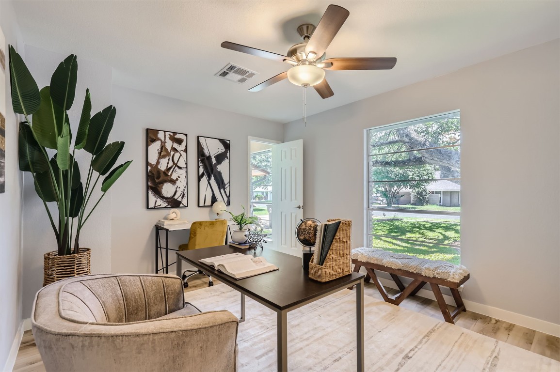 12306 Double Tree Lane Austin, TX 78750 - Photo 10 of 38 a living room with furniture and a potted plant
