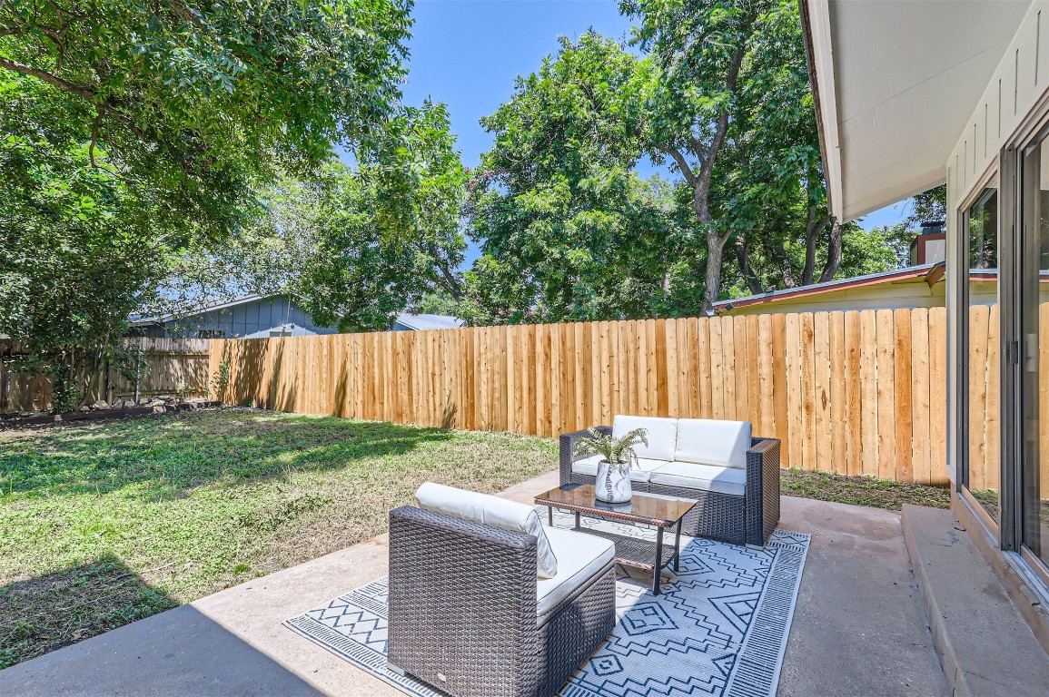 12306 Double Tree Lane Austin, TX 78750 - Photo 24 of 38 a backyard of a house with table and chairs