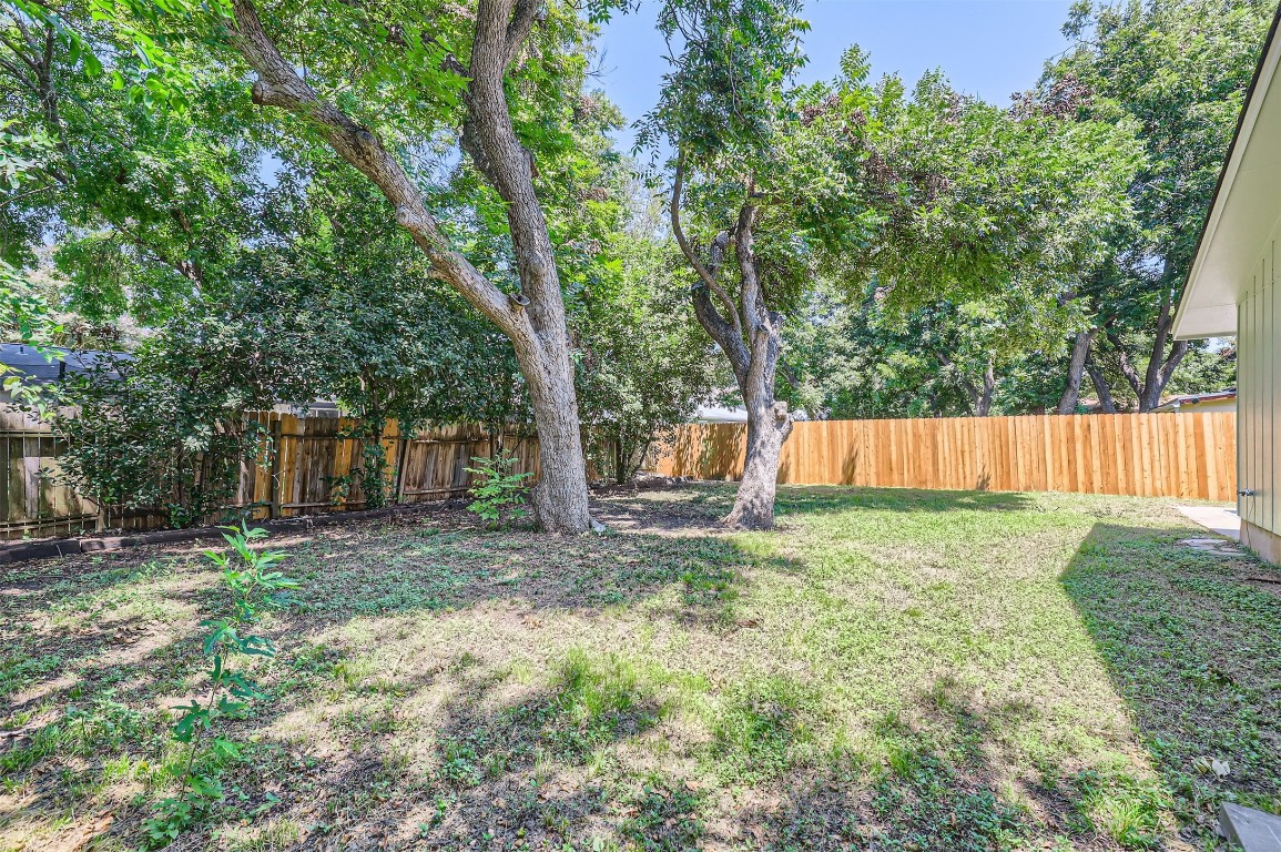 12306 Double Tree Lane Austin, TX 78750 - Photo 25 of 38 a backyard of a house with lots of green space