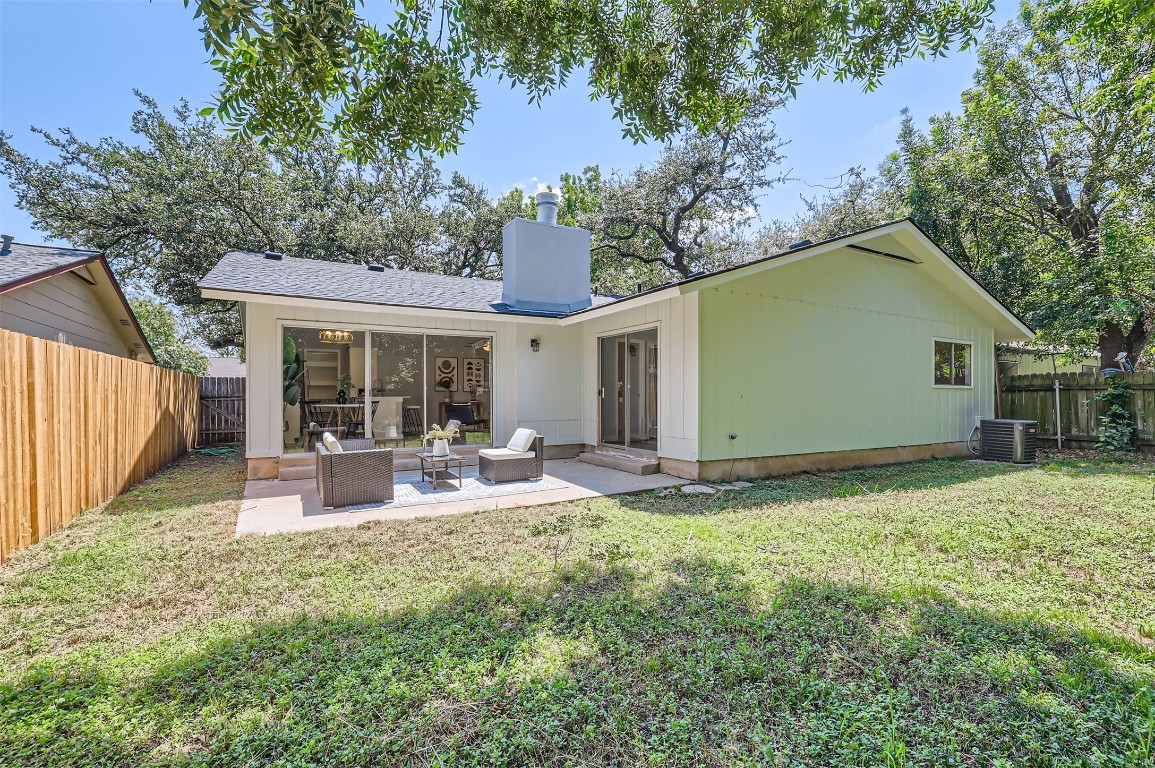 12306 Double Tree Lane Austin, TX 78750 - Photo 26 of 38 a view of backyard of house with outdoor seating and green space