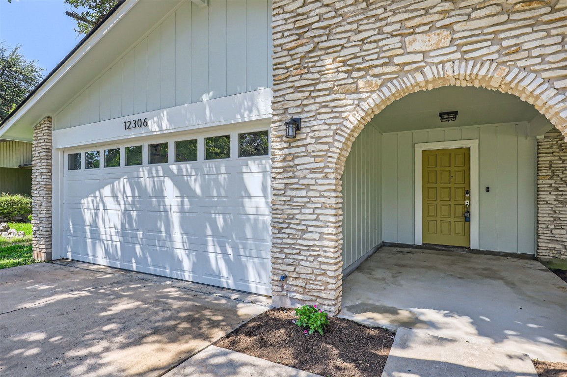 12306 Double Tree Lane Austin, TX 78750 - Photo 2 of 38 a front view of a house with a garage
