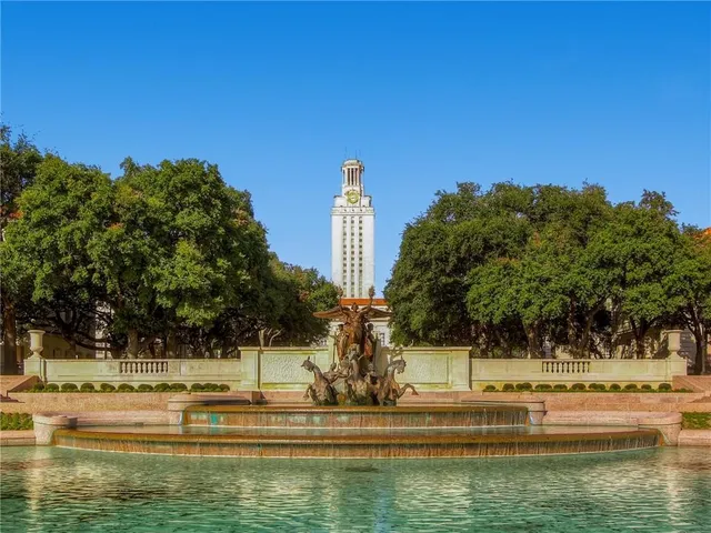 a view of swimming pool with outdoor seating and city view