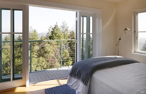 a bedroom with a bed and a table