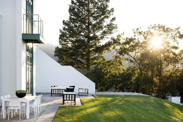 a view of a green field with lots of bushes
