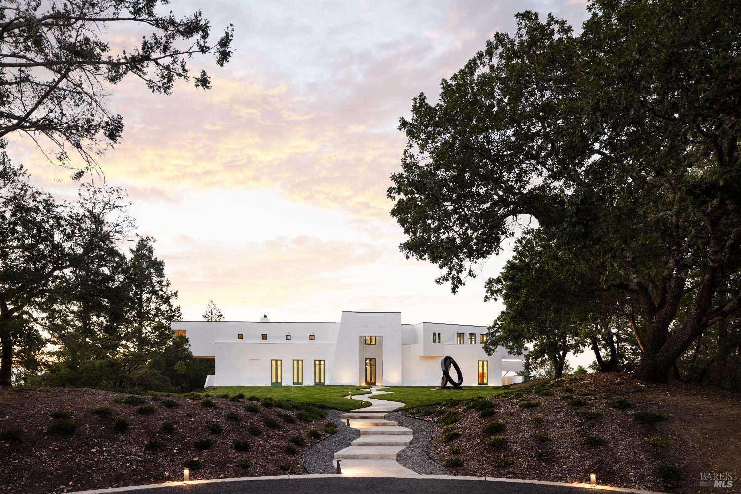 3000 Mt Veeder Road Napa, CA 94558 - Photo 53 of 85 a view of a white house next to a yard with potted plants