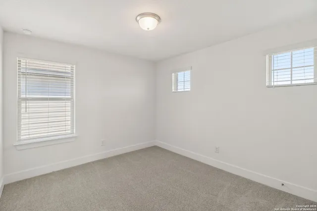 an empty room with closet area