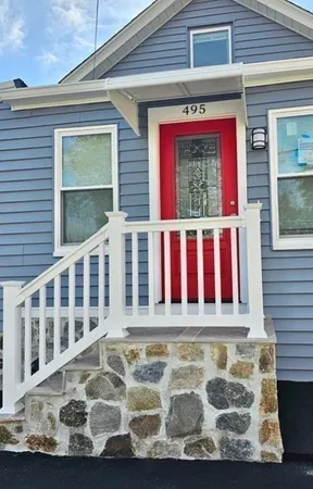 a view of a house with a small yard