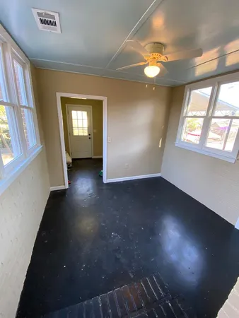 a view of a livingroom with a hall and a window