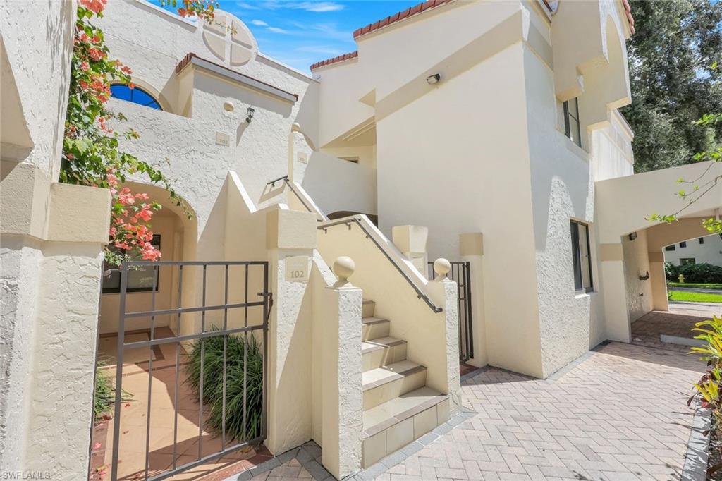 6555 Valen Way, Unit G201 Naples, FL 34108 - Photo 25 of 26 a view of entryway livingroom and hall with wooden floor