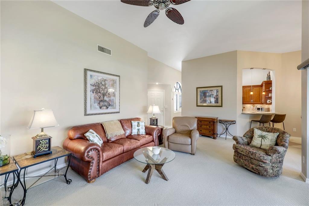 6555 Valen Way, Unit G201 Naples, FL 34108 - Photo 4 of 26 a living room with furniture and a potted plant