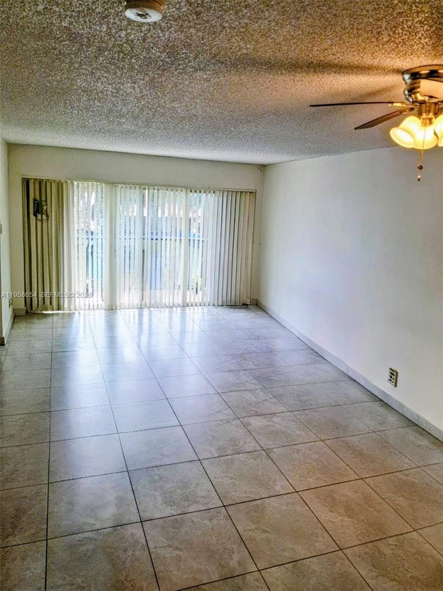 8801 Wiles Road, Unit 208 Coral Springs, FL 33067 - Photo 2 of 11 a view of an empty room and window
