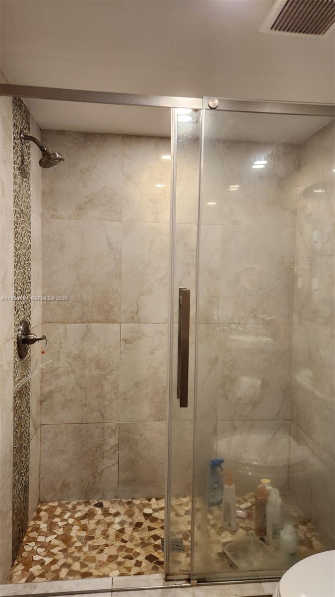8801 Wiles Road, Unit 208 Coral Springs, FL 33067 - Photo 7 of 11 a bathroom with a shower