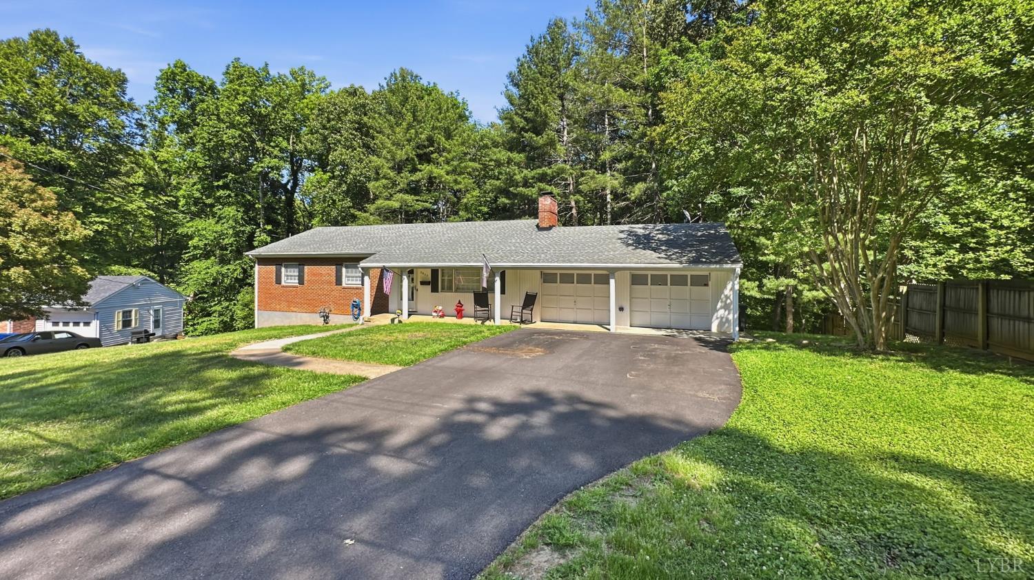 2044 Indian Hill Road Lynchburg, VA 24503 - Photo 28 of 30 a front view of a house with a yard and garage