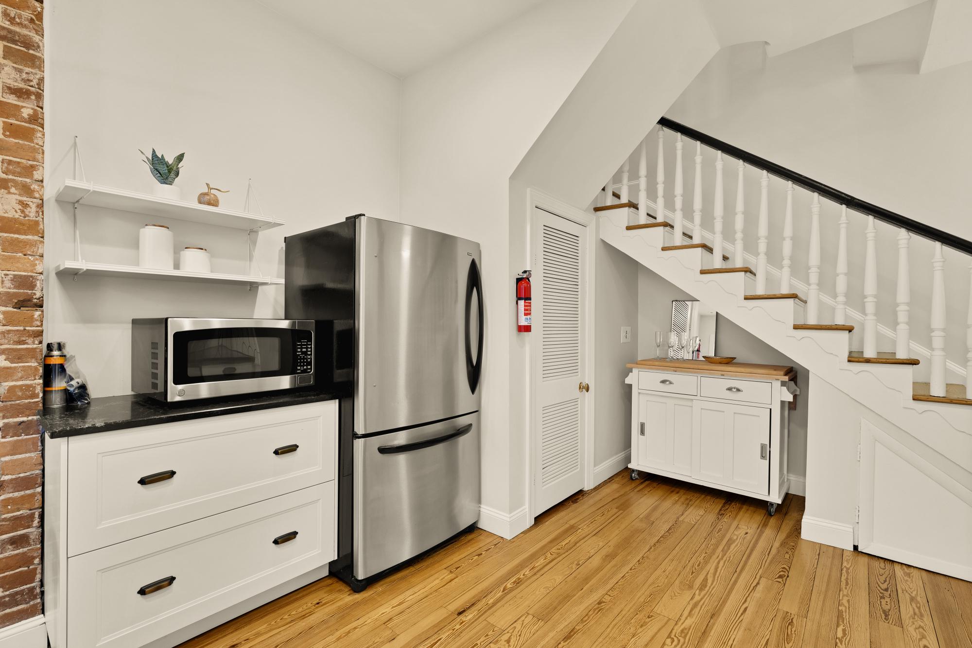 619 Independence Avenue Southeast Washington, DC 20003 - Photo 15 of 38 a kitchen with a refrigerator and white cabinets