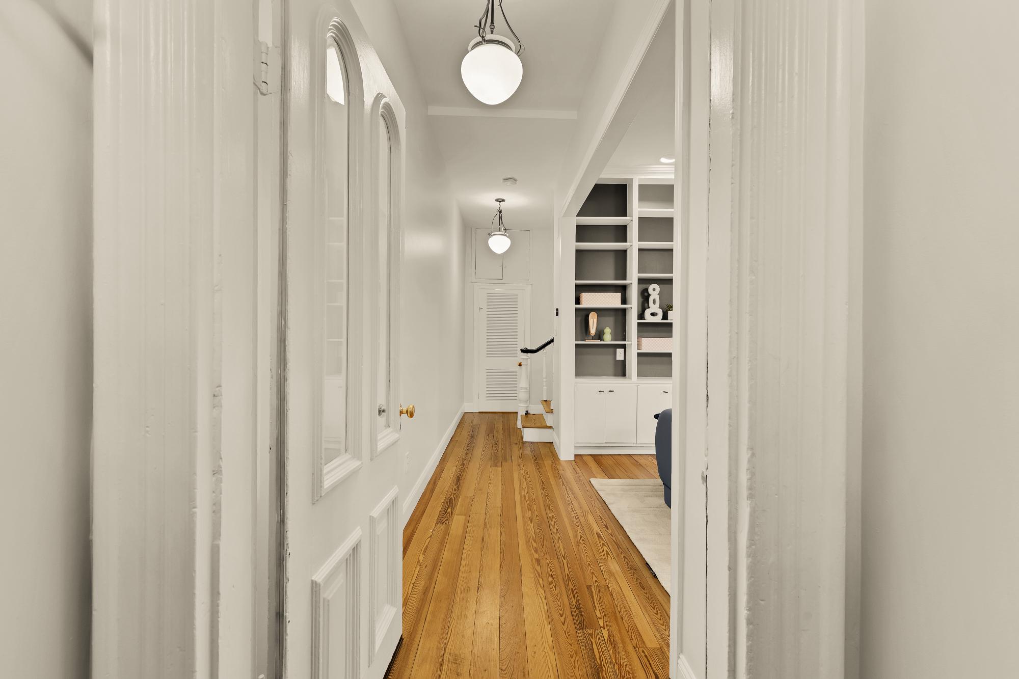 619 Independence Avenue Southeast Washington, DC 20003 - Photo 2 of 38 a view of a hallway with wooden floor and staircase