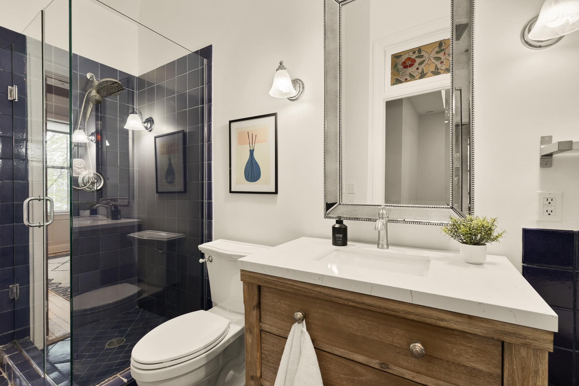 619 Independence Avenue Southeast Washington, DC 20003 - Photo 21 of 38 a bathroom with a sink a toilet and shower