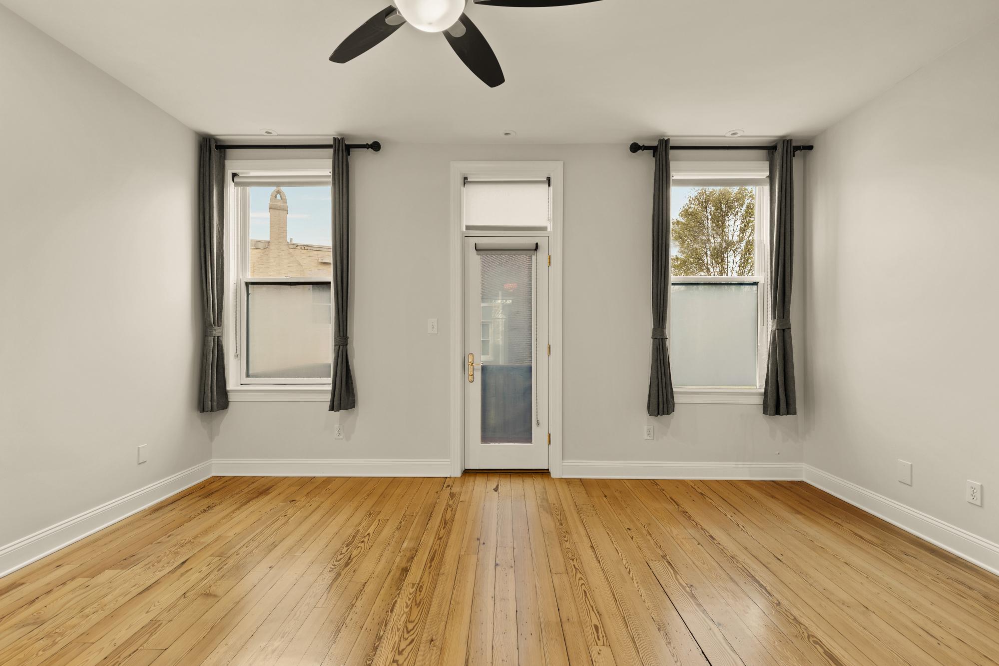619 Independence Avenue Southeast Washington, DC 20003 - Photo 24 of 38 an empty room with wooden floor cabinet and windows