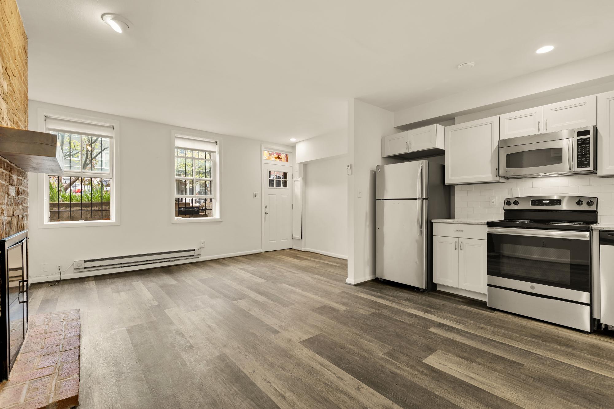 619 Independence Avenue Southeast Washington, DC 20003 - Photo 30 of 38 a view of kitchen with wooden floor electronic appliances and window