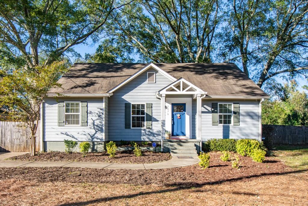 3076 Leeland Road Decatur, GA 30032 - Photo 1 of 1 a view of a white house with large windows next to a road
