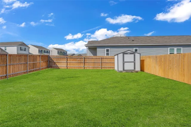 a view of a backyard with a garden