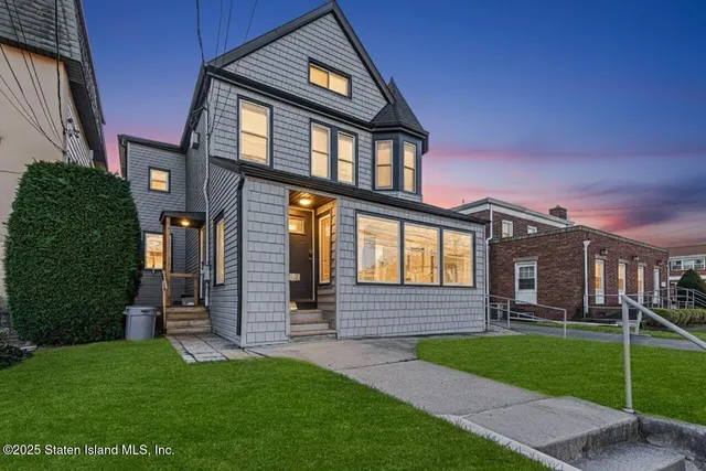 front view of a house with a yard