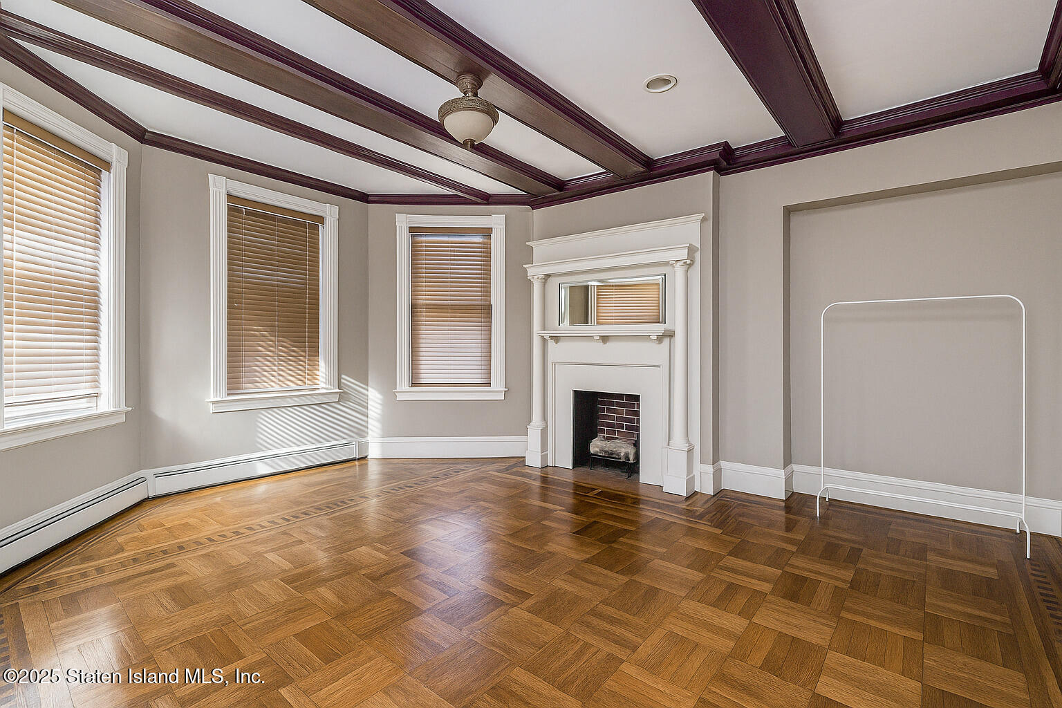 4062 Amboy Road Staten Island, NY 10308 - Photo 18 of 21 a view of empty room with a fireplace and windows