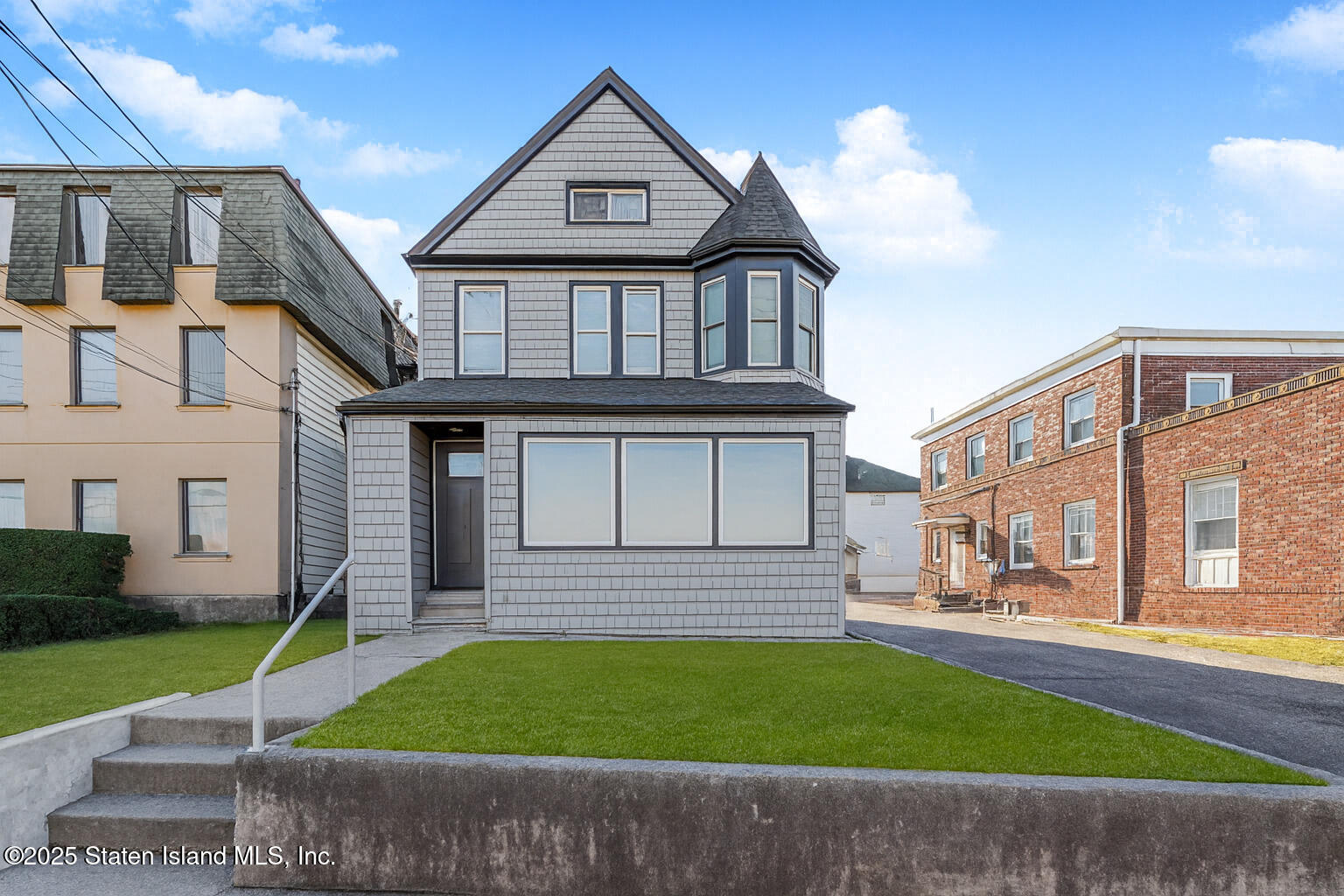 4062 Amboy Road Staten Island, NY 10308 - Photo 3 of 21 a front view of a house with a yard