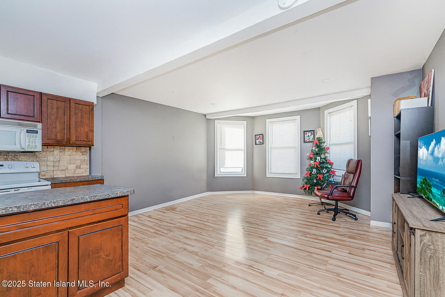 4062 Amboy Road Staten Island, NY 10308 - Photo 8 of 21 a living room with furniture and a flat screen tv