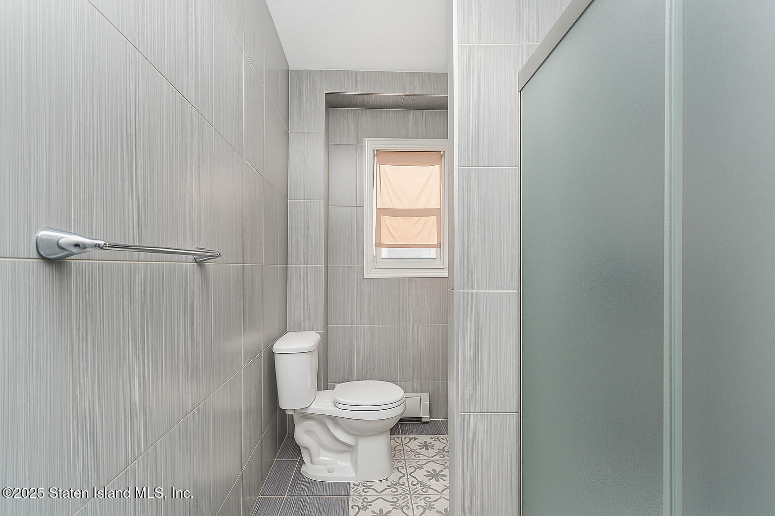 4062 Amboy Road Staten Island, NY 10308 - Photo 9 of 21 a white toilet sitting next to a bathroom sink