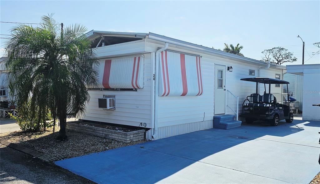 10315 Cortez Road West, Unit 242 Bradenton, FL 34210 - Photo 3 of 18 a front view of a house with patio