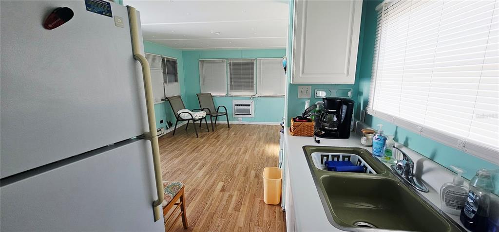 10315 Cortez Road West, Unit 242 Bradenton, FL 34210 - Photo 9 of 18 a room with furniture a rug and a window