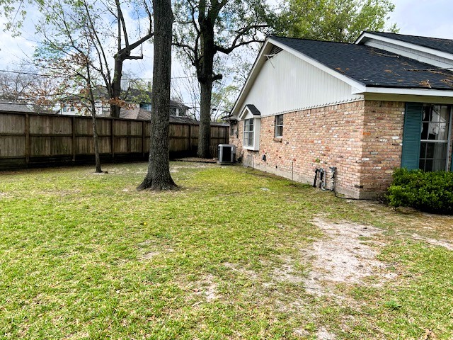 8639 Cedarbrake Drive Spring Valley Village, TX 77055 - Photo 9 of 26 Discover the charm of this inviting front side yard to the left of the home, perfect for outdoor relaxation and shaded by mature trees.