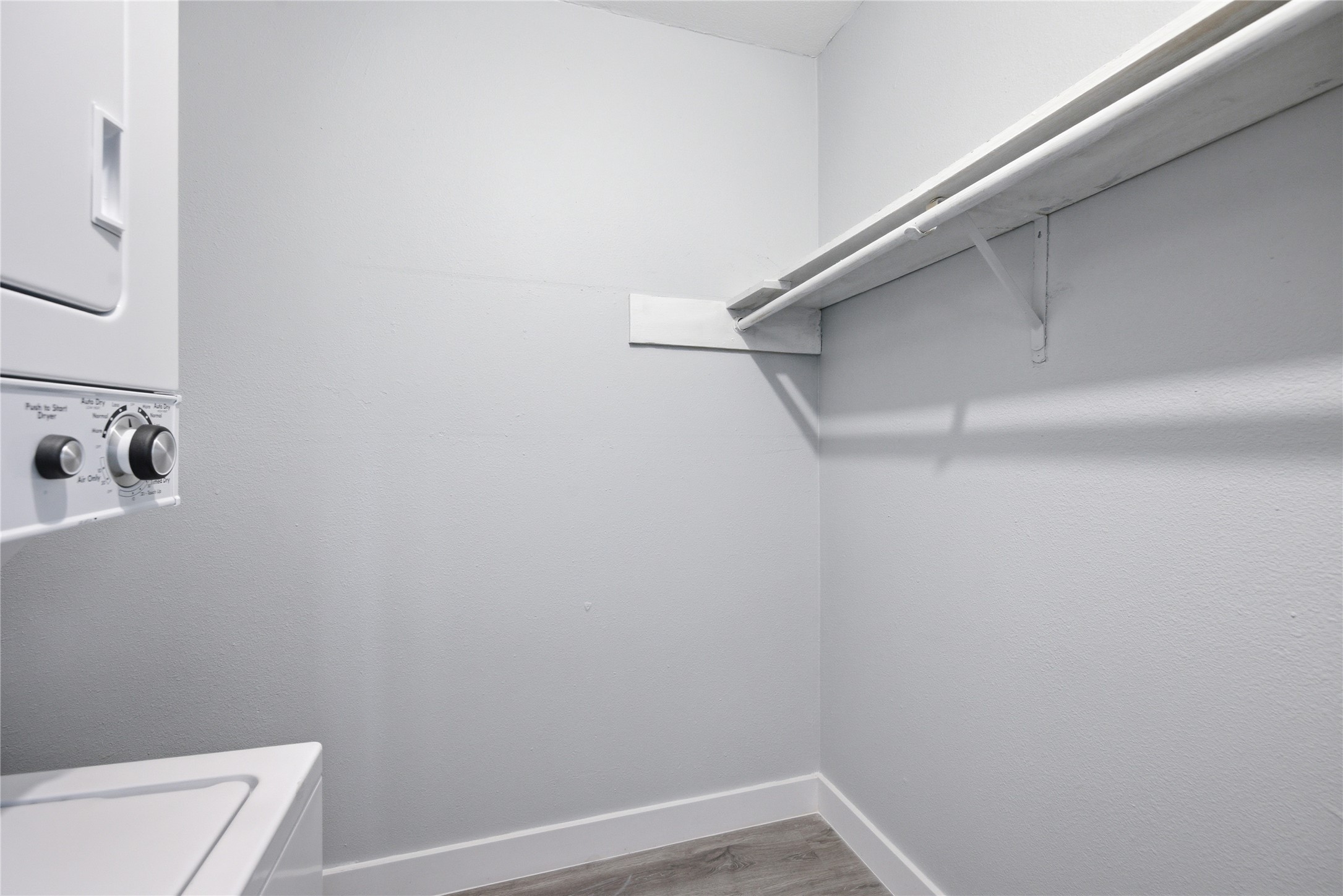 2401 Manor Road, Unit 232 Austin, TX 78722 - Photo 14 of 32 Walk in closet featuring a stacked washing machine and dryer