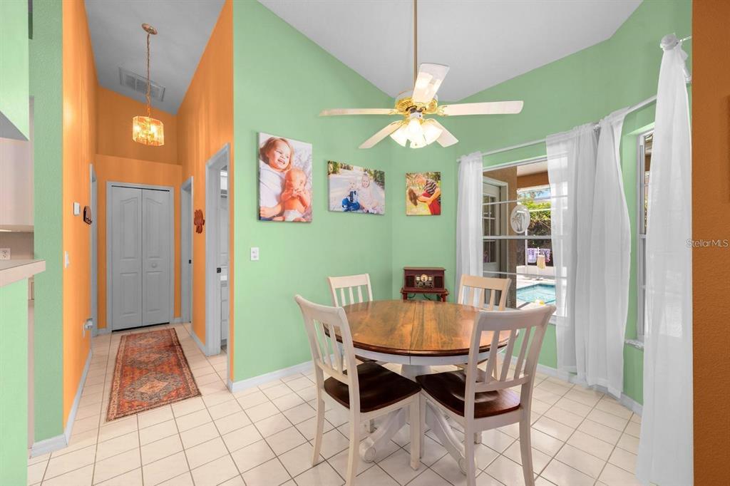 10228 Yellow Pine Way Hudson, FL 34667 - Photo 9 of 22 a view of a dining room with furniture and chandelier