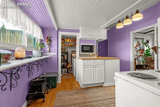 a kitchen with stainless steel appliances a refrigerator sink and wooden cabinets