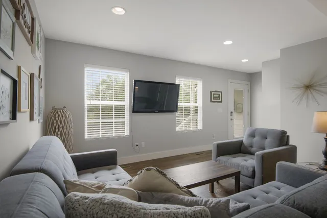 a kitchen with kitchen island a sink stainless steel appliances and cabinets