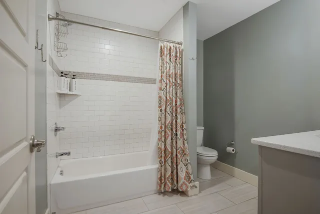 a front view of a house with a yard table and chairs