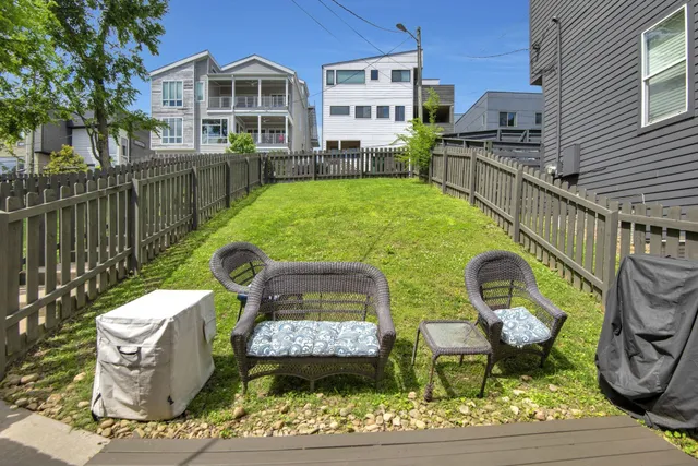 a kitchen with cabinets table and chairs