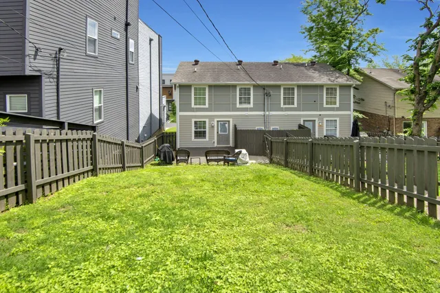 a kitchen with stainless steel appliances granite countertop a kitchen island a stove a table and chairs in it