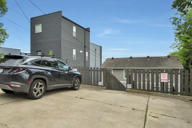 a kitchen with granite countertop a sink stainless steel appliances and cabinets