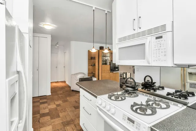 a kitchen with stainless steel appliances a refrigerator and a sink