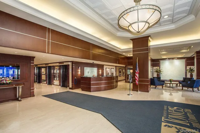 a view of a swimming pool with a lounge chair