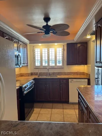 a kitchen with stainless steel appliances granite countertop a sink and stove