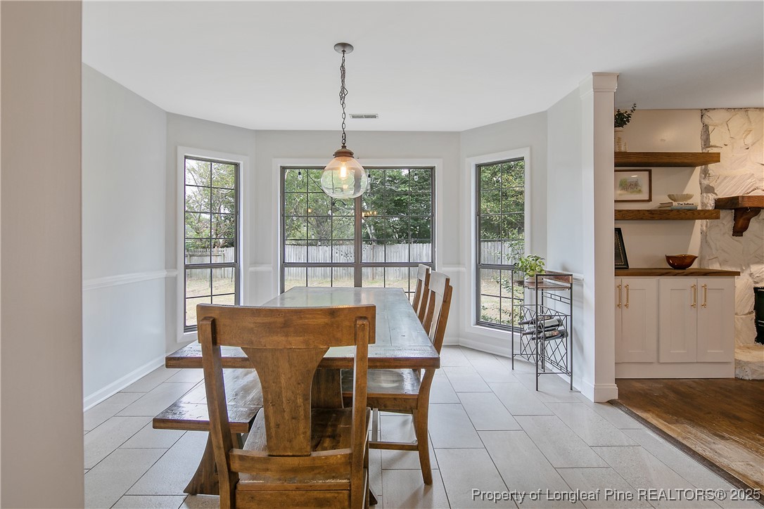 64 California Lane Spring Lake, NC 28390 - Photo 15 of 50 a view of a dining room with furniture window and outside view