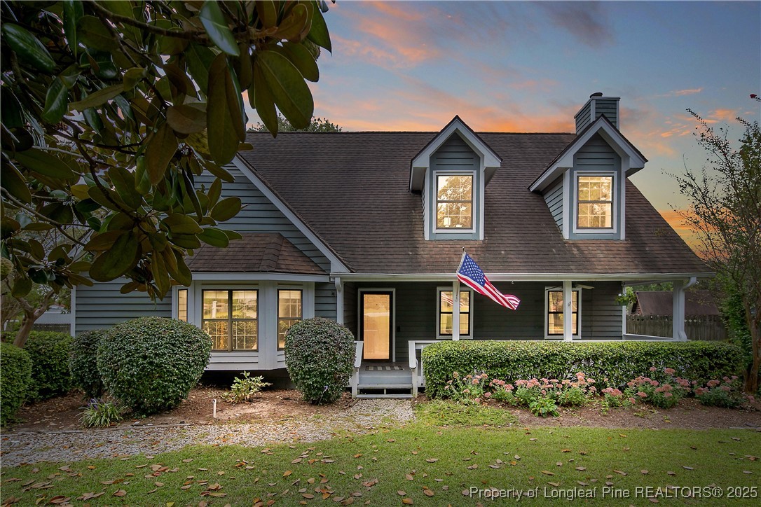 64 California Lane Spring Lake, NC 28390 - Photo 2 of 50 front view of a house with a yard