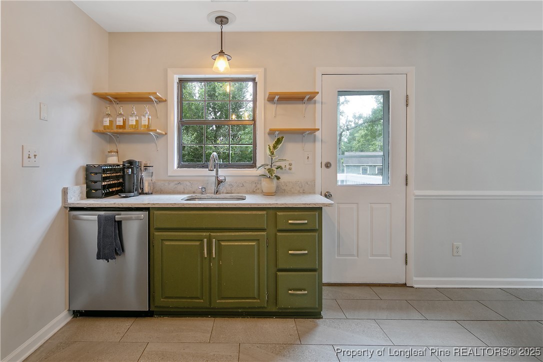 64 California Lane Spring Lake, NC 28390 - Photo 22 of 50 a kitchen with a sink cabinets and window