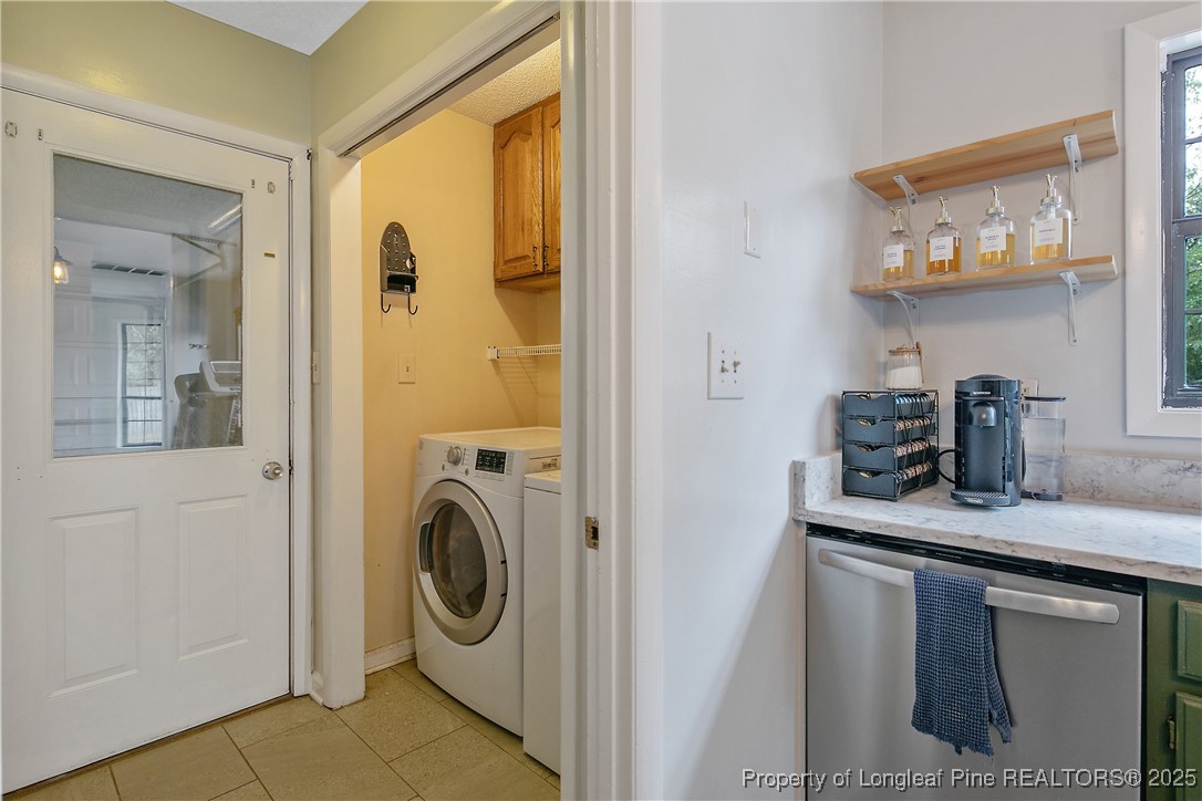 64 California Lane Spring Lake, NC 28390 - Photo 23 of 50 a utility room with sink dryer and washer