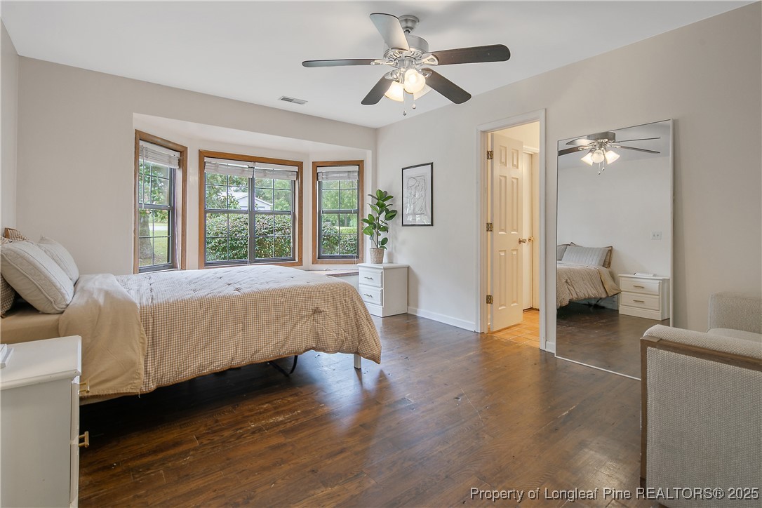 64 California Lane Spring Lake, NC 28390 - Photo 25 of 50 a living room with a bed furniture and a large window